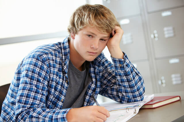 Teenage boy in class